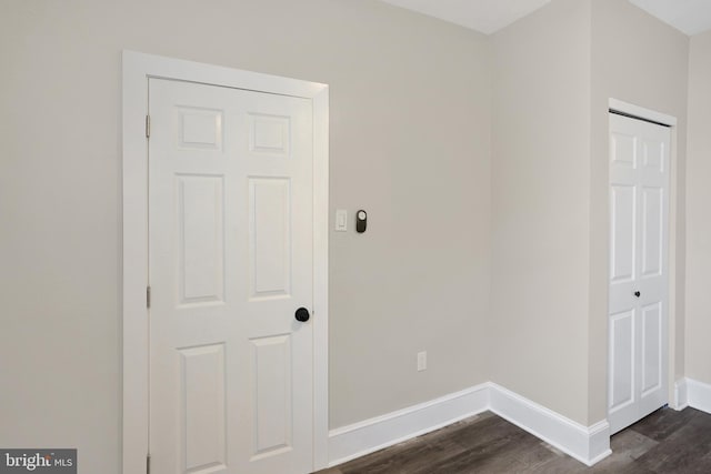 6706 Marsden St, Philadelphia, PA 19135 - washroom with baseboards and dark wood-type flooring