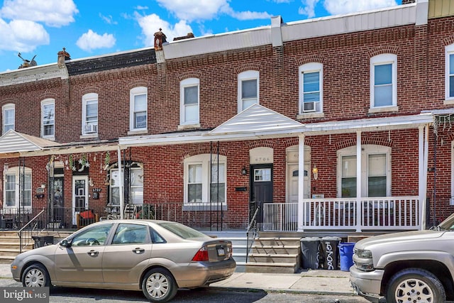 6706 Marsden St, Philadelphia, PA 19135 - view of property with brick siding and a porch