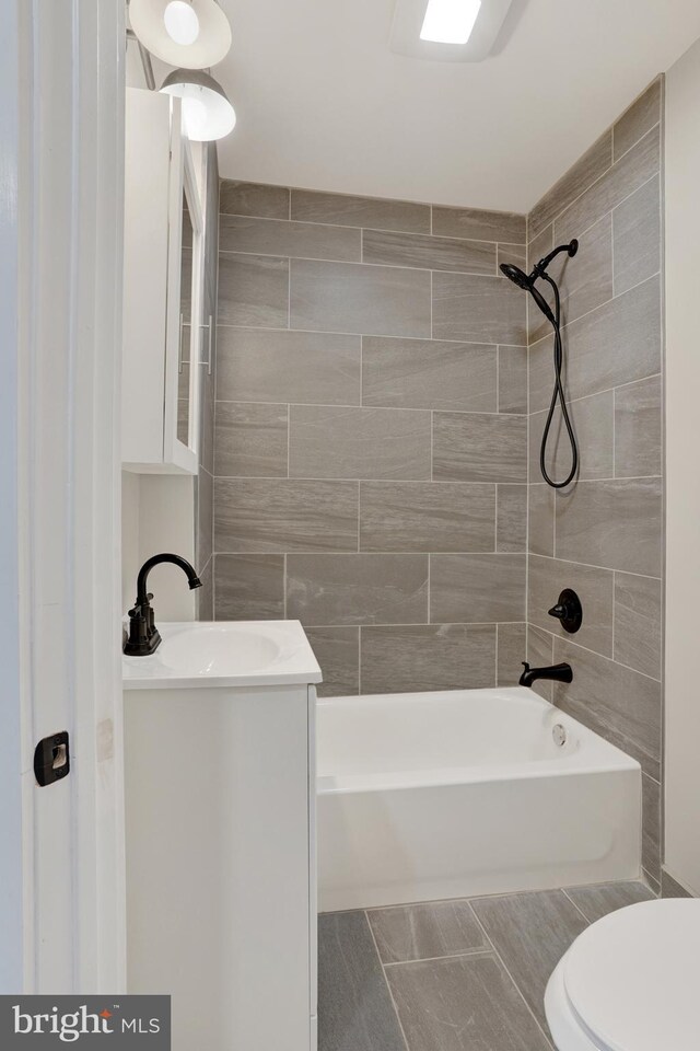6706 Marsden St, Philadelphia, PA 19135 - bathroom featuring bathing tub / shower combination, toilet, and vanity
