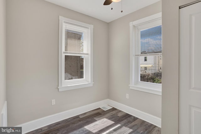 6706 Marsden St, Philadelphia, PA 19135 - unfurnished room featuring healthy amount of natural light, dark wood-type flooring, baseboards, and a ceiling fan