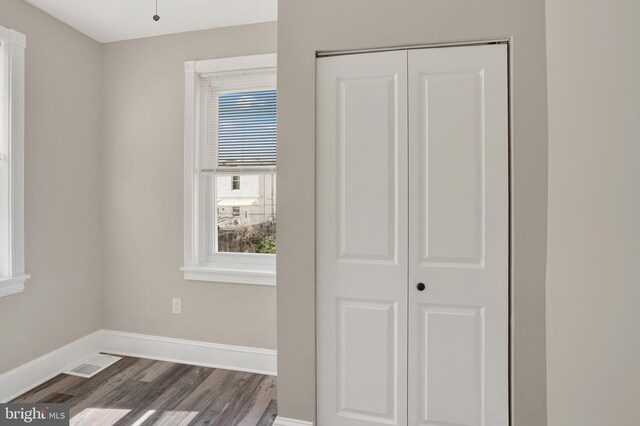 6706 Marsden St, Philadelphia, PA 19135 - spare room featuring dark wood-style floors and baseboards