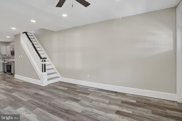 6706 Marsden St, Philadelphia, PA 19135 - basement with ceiling fan, baseboards, wood finished floors, stairs, and recessed lighting