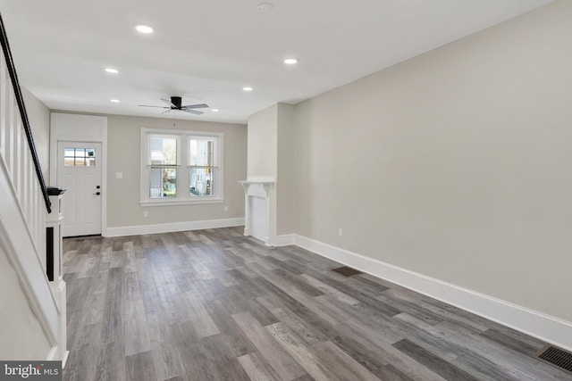 6706 Marsden St, Philadelphia, PA 19135 - unfurnished living room featuring ceiling fan, wood finished floors, baseboards, recessed lighting, and stairs
