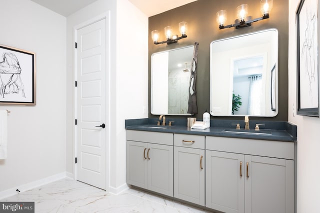 42152 Stone Press Ter, Brambleton, VA 20148 - full bathroom with double vanity, a marble finish shower, baseboards, and marble look tile flooring