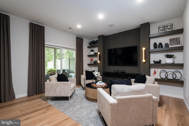 42152 Stone Press Ter, Brambleton, VA 20148 - living room with light wood finished floors, recessed lighting, and baseboards