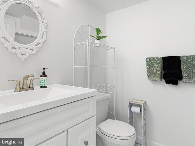 411 Stonebridge Blvd, New Castle, DE 19720 - bathroom featuring vanity, toilet, and baseboards