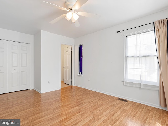 411 Stonebridge Blvd, New Castle, DE 19720 - unfurnished bedroom with light wood-style floors, a closet, baseboards, and a ceiling fan