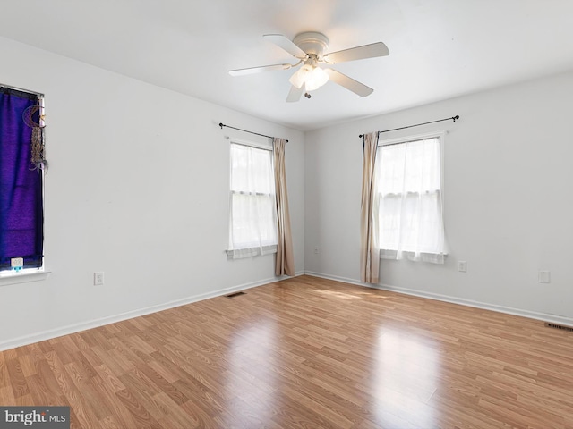 411 Stonebridge Blvd, New Castle, DE 19720 - spare room featuring wood finished floors, a ceiling fan, and baseboards