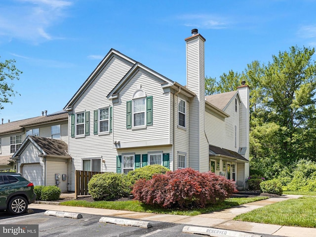411 Stonebridge Blvd, New Castle, DE 19720 - multi unit property featuring uncovered parking and a chimney