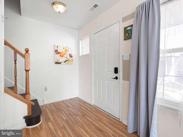 411 Stonebridge Blvd, New Castle, DE 19720 - entryway with wood finished floors, stairs, and baseboards
