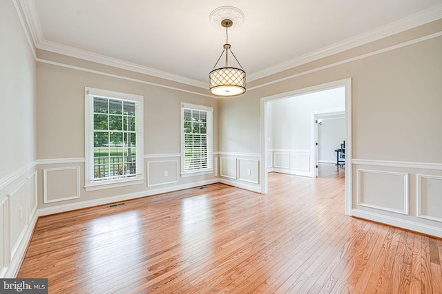 38452 Millstone, Purcellville, VA 20132 - unfurnished room with light wood-style floors, crown molding, wainscoting, and a decorative wall