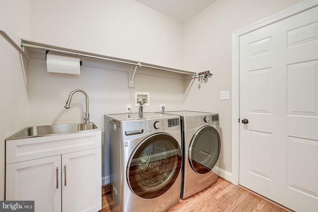 38452 Millstone, Purcellville, VA 20132 - clothes washing area featuring washer and clothes dryer, light wood-style floors, cabinet space, and baseboards