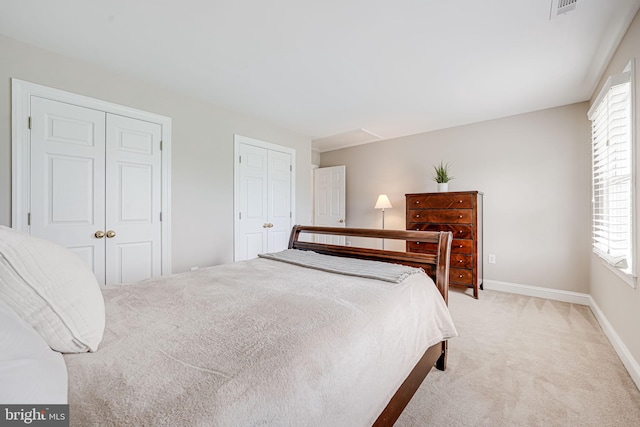 38452 Millstone, Purcellville, VA 20132 - bedroom with light carpet, baseboards, and multiple closets