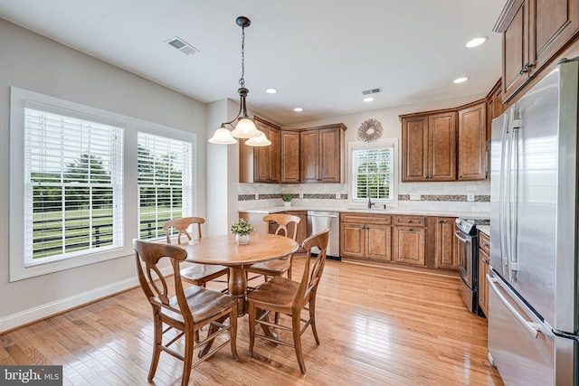 38452 Millstone, Purcellville, VA 20132 - kitchen with stainless steel appliances, a sink, backsplash, light countertops, and recessed lighting