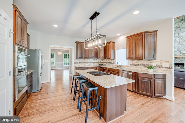 38452 Millstone, Purcellville, VA 20132 - kitchen with stainless steel appliances, tasteful backsplash, light wood finished floors, and recessed lighting