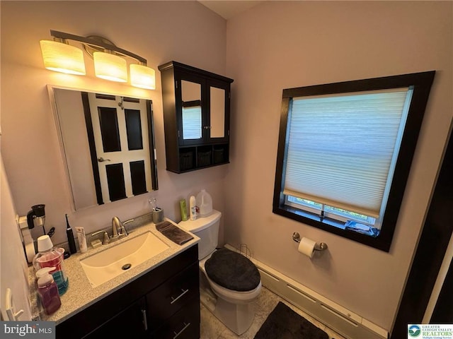 bathroom with toilet, baseboard heating, and vanity