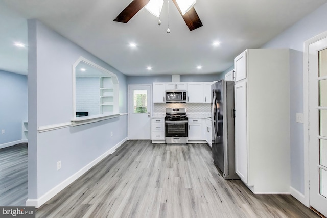 kitchen with appliances with stainless steel finishes, ceiling fan, light wood-style flooring, and recessed lighting