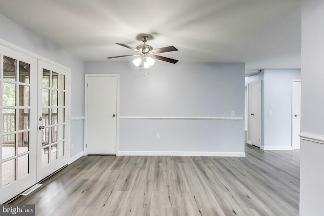 unfurnished room featuring french doors, ceiling fan, wood finished floors, and baseboards