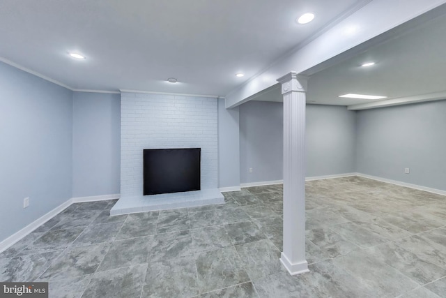 finished below grade area with recessed lighting, crown molding, baseboards, a brick fireplace, and tile patterned flooring