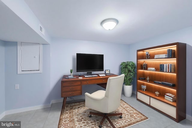 office with baseboards and light tile patterned floors