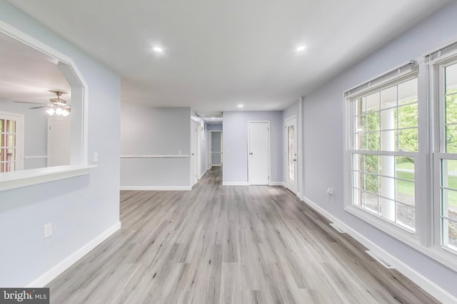 spare room featuring wood finished floors, ceiling fan, baseboards, and recessed lighting