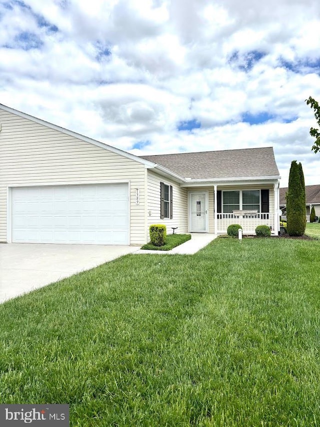 view of front of property with a porch, driveway, an attached garage, and a front yard