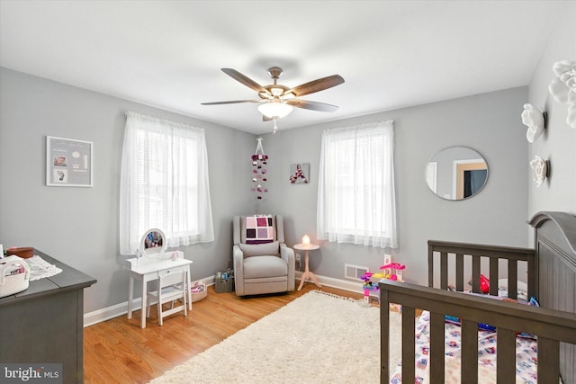8907 Mavis Ave, Baltimore, MD 21236 - bedroom featuring wood finished floors, baseboards, and a ceiling fan