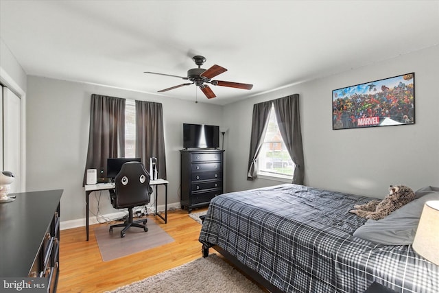 8907 Mavis Ave, Baltimore, MD 21236 - bedroom featuring light wood finished floors, an office area, a ceiling fan, a closet, and baseboards