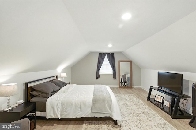 8907 Mavis Ave, Baltimore, MD 21236 - bedroom with wood finished floors, vaulted ceiling, and baseboards