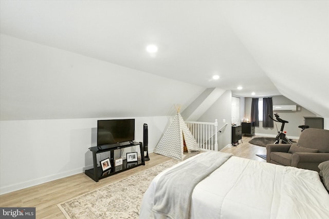 8907 Mavis Ave, Baltimore, MD 21236 - bedroom with light wood finished floors, a wall unit AC, vaulted ceiling, baseboards, and recessed lighting