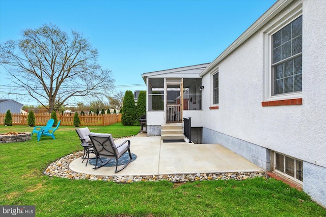 8907 Mavis Ave, Baltimore, MD 21236 - view of patio / terrace featuring an outdoor fire pit, a sunroom, and entry steps