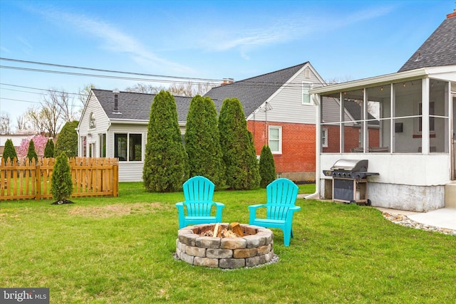 8907 Mavis Ave, Baltimore, MD 21236 - view of yard featuring a fire pit and a sunroom