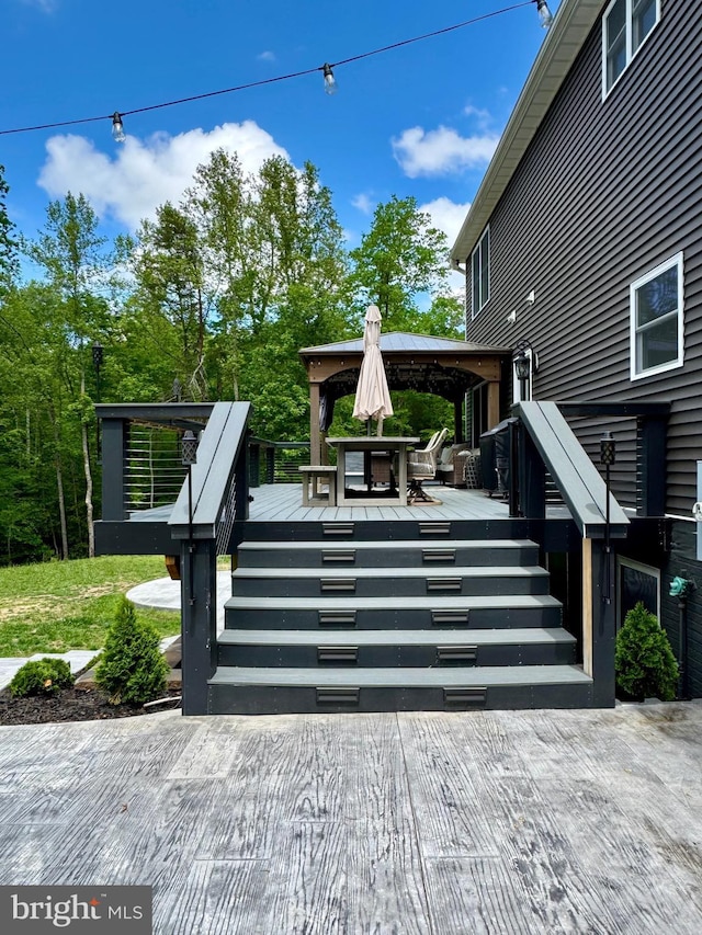 wooden terrace featuring stairway