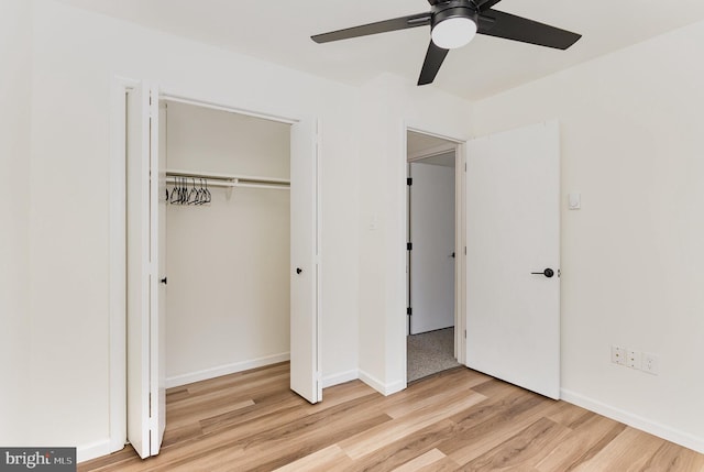 8838 Mckinley Ct, Hummelstown, PA 17036 - unfurnished bedroom featuring wood finished floors, a closet, baseboards, and a ceiling fan