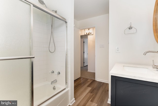 8838 Mckinley Ct, Hummelstown, PA 17036 - bathroom featuring wood finished floors, shower / bathtub combination, vanity, and baseboards
