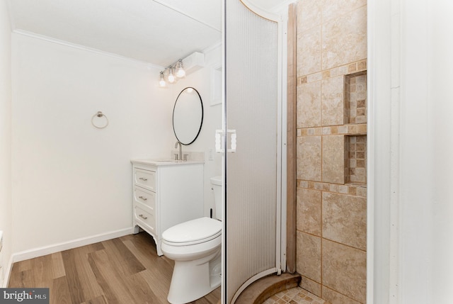 8838 Mckinley Ct, Hummelstown, PA 17036 - bathroom with toilet, ornamental molding, vanity, and wood finished floors
