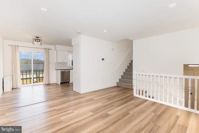 8838 Mckinley Ct, Hummelstown, PA 17036 - unfurnished living room featuring light wood-style flooring, recessed lighting, and baseboards