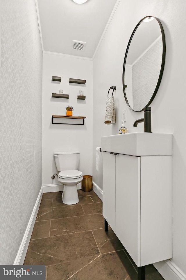 419 S E Ave, Baltimore, MD 21224 - bathroom with wallpapered walls, crown molding, vanity, toilet, and baseboards