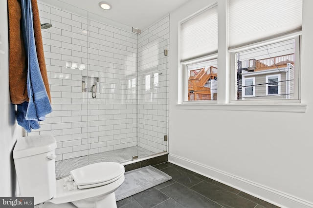 419 S E Ave, Baltimore, MD 21224 - bathroom with toilet, a stall shower, and baseboards