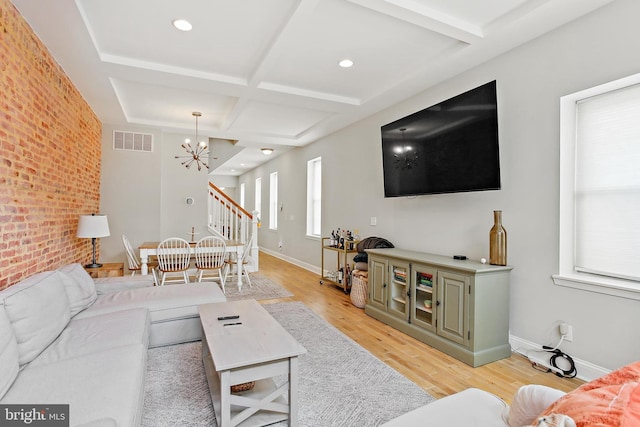 419 S E Ave, Baltimore, MD 21224 - living room with a chandelier, coffered ceiling, light wood-style flooring, beamed ceiling, and baseboards