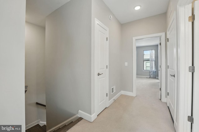 9870 Buchanan Loop, Manassas, VA 20110 - corridor featuring baseboards, an upstairs landing, and light carpet
