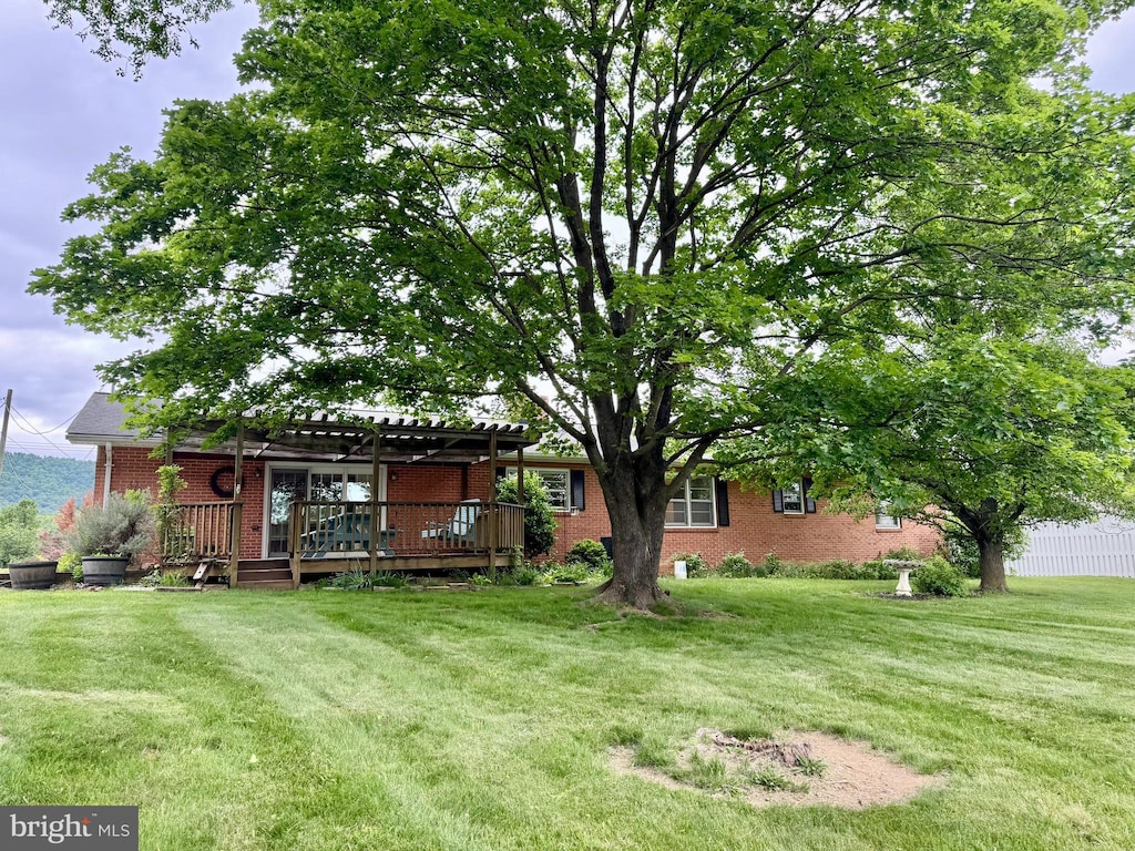 1793 N Hayfield Rd, Winchester, VA 22603 - view of grassy yard with a deck and a pergola