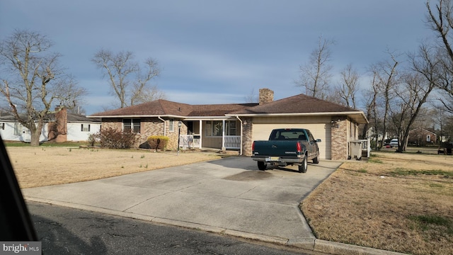 319 Morton Ave, Paulsboro, NJ 08066 - ranch-style home featuring a garage, a porch, a chimney, concrete driveway, and brick siding