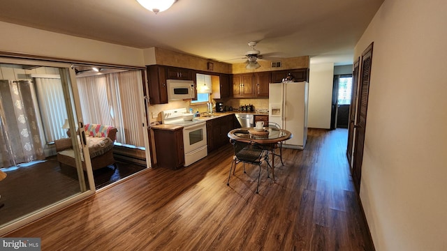 319 Morton Ave, Paulsboro, NJ 08066 - kitchen featuring white appliances, dark wood finished floors, ceiling fan, light countertops, and a sink