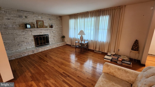 319 Morton Ave, Paulsboro, NJ 08066 - living area with wood-type flooring, a fireplace, and baseboards