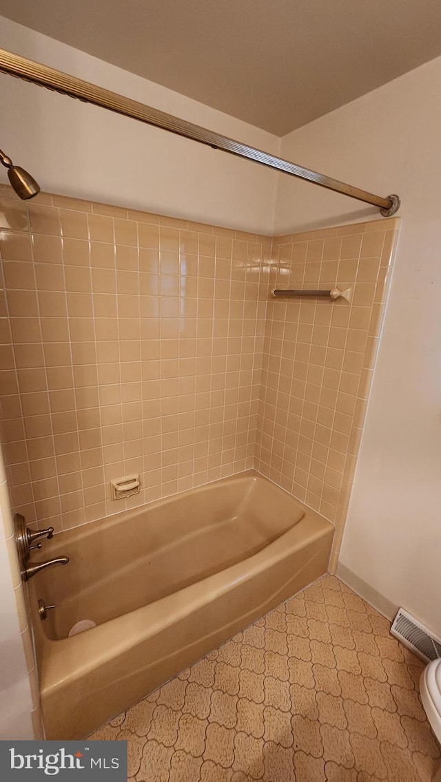 319 Morton Ave, Paulsboro, NJ 08066 - bathroom with tub / shower combination, toilet, and baseboards