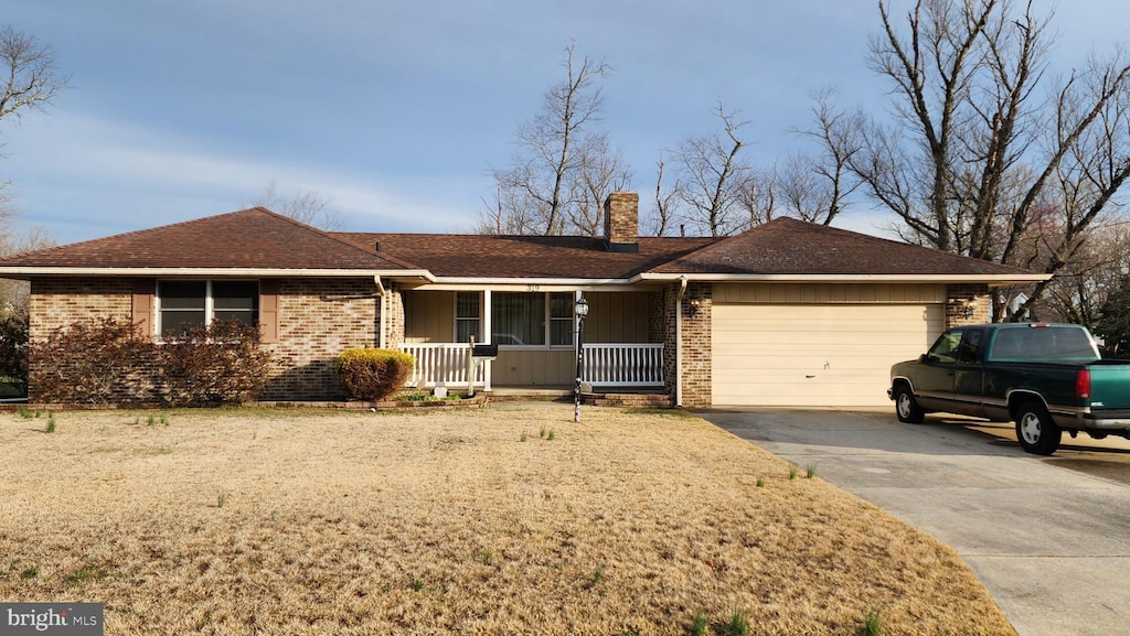 319 Morton Ave, Paulsboro, NJ 08066 - ranch-style home featuring covered porch, brick siding, an attached garage, and a chimney