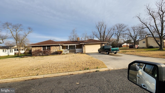 319 Morton Ave, Paulsboro, NJ 08066 - ranch-style home featuring driveway, a garage, a chimney, and brick siding