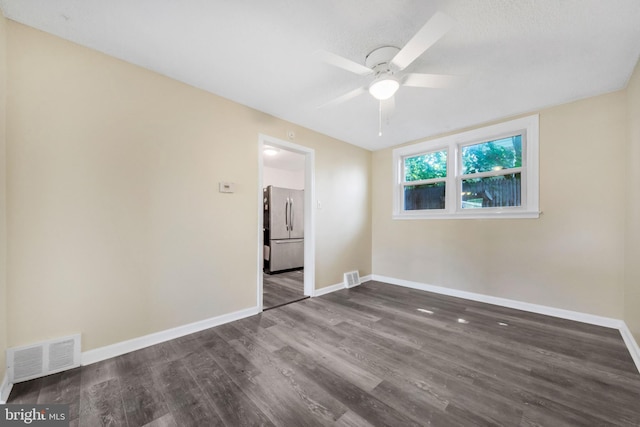 415 Arlington Ave, Upper Darby, PA 19082 - unfurnished bedroom with freestanding refrigerator, dark wood finished floors, baseboards, and a ceiling fan