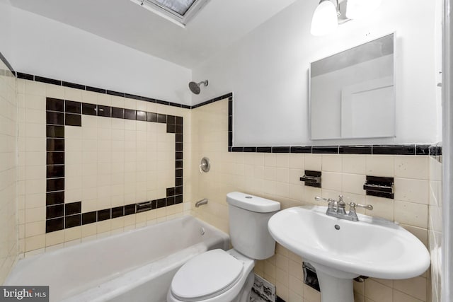 415 Arlington Ave, Upper Darby, PA 19082 - bathroom with tile walls, a sink, toilet, and shower / bath combination